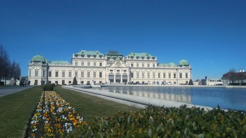 Historic building upper belvedere against blue sky in vienna, austria