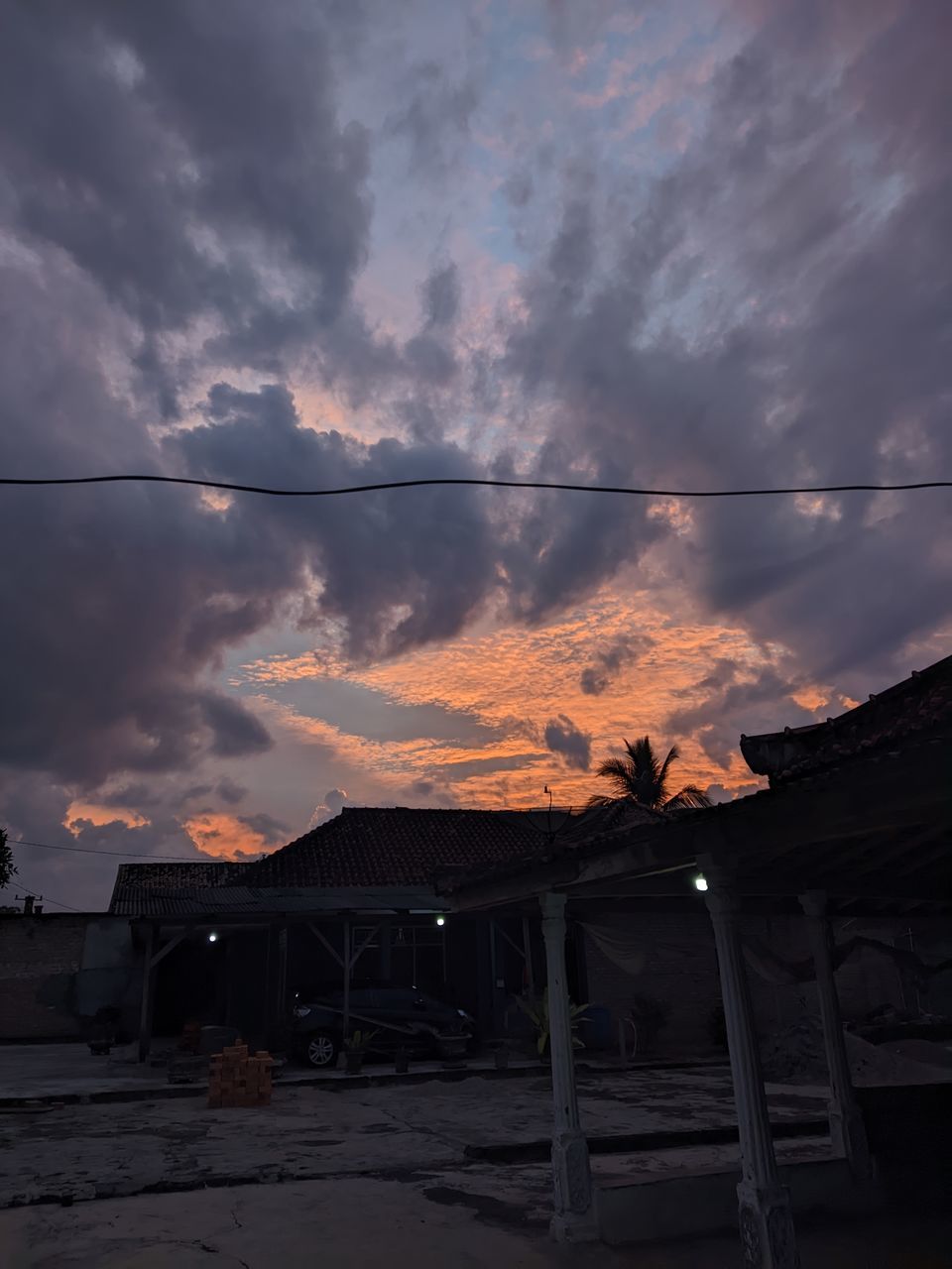 sky, cloud, sunset, evening, architecture, sunlight, built structure, dusk, nature, darkness, building exterior, house, building, light, no people, dramatic sky, beauty in nature, outdoors, environment, silhouette, mountain, landscape