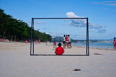 People playing on beach