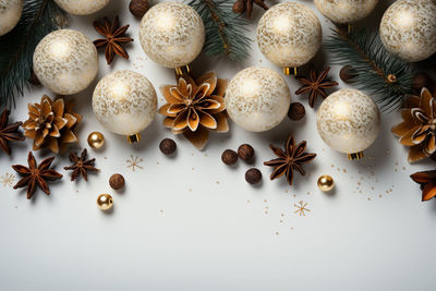 Close-up of christmas decorations on white background