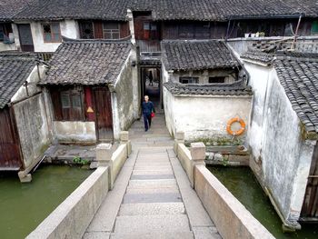 High angle view of man walking on roof