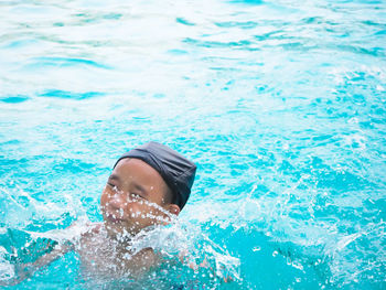 High angle view of girl swimming in pool