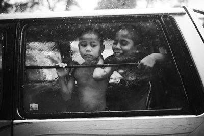 Portrait of boy in car window