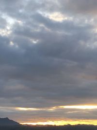 Low angle view of dramatic sky during sunset