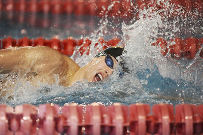 Man swimming in pool