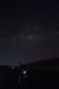 Scenic view of field against sky at night