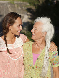 Adult daughter and mother looking at each other