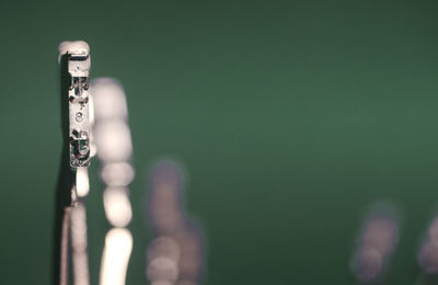 Close-up of chain against wall