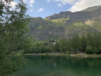 Scenic view of lake and mountains against sky