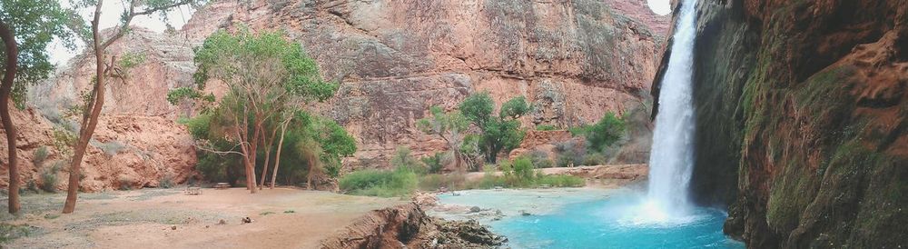 Scenic view of river flowing through rocks