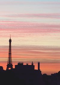 Silhouette of eiffel tower against sky at sunset