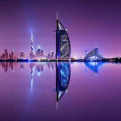 Reflection of buildings in city at night