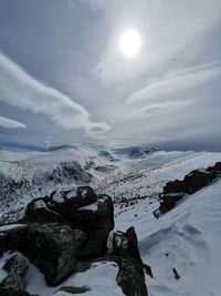 Scenic view of snowcapped mountains against sky during winter