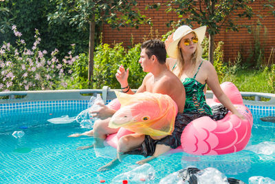 Young couple in swimming pool