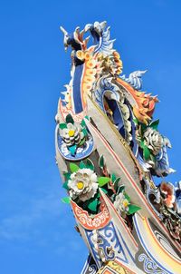 Low angle view of chinese dragon against sky