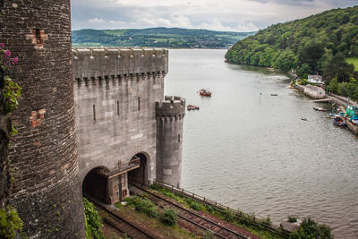 High angle view of historic building by sea