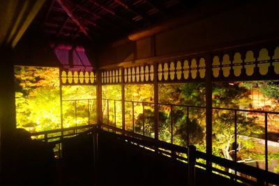 Illuminated building seen through glass window