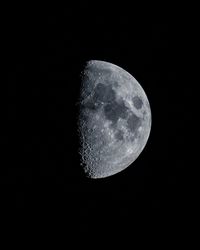 Low angle view of moon against sky at night