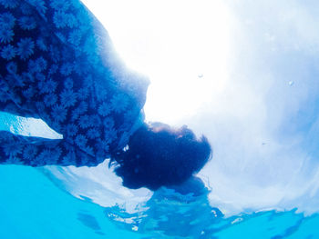 Scenic view of snow covered mountain against blue sky