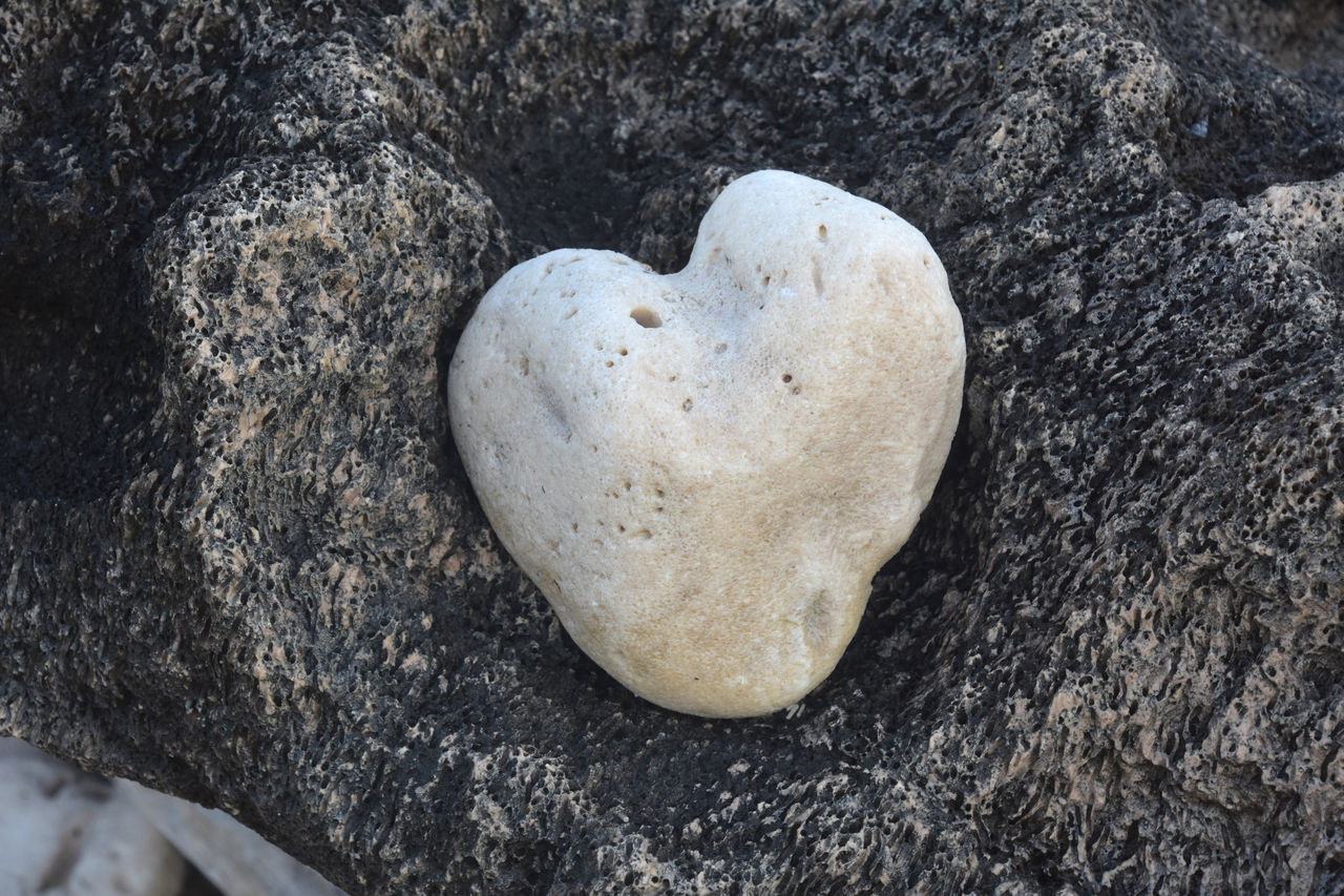 heart shape, love, positive emotion, emotion, rock, high angle view, no people, valentine's day, nature, close-up, land, day, heart, outdoors, shape, directly above, still life, textured, stone, food, beach, creativity, food and drink