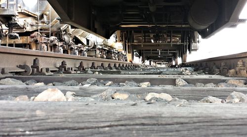 View of railroad tracks by building during winter