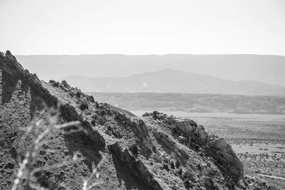 Panoramic view of sea and mountains against clear sky