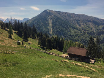 Scenic view of landscape and mountains against sky