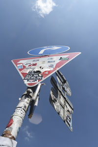 Low angle view of airplane flying against sky