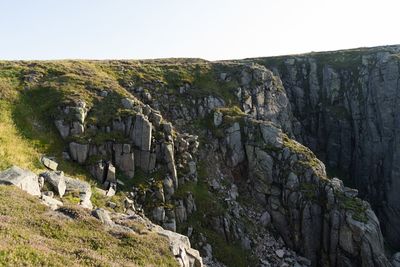 Scenic view of cliff against clear sky