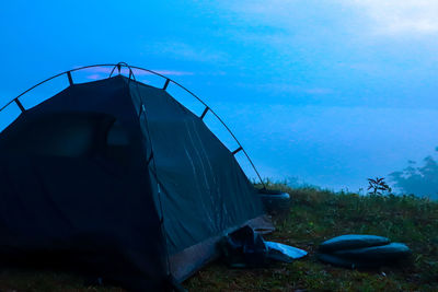 Tent on field against sky