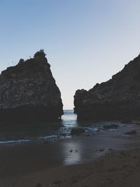 Scenic view of beach against clear sky