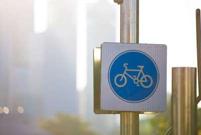 Low angle view of road sign in city