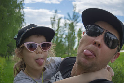 Portrait of two people wearing sunglasses