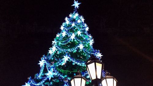 Low angle view of illuminated lamp post