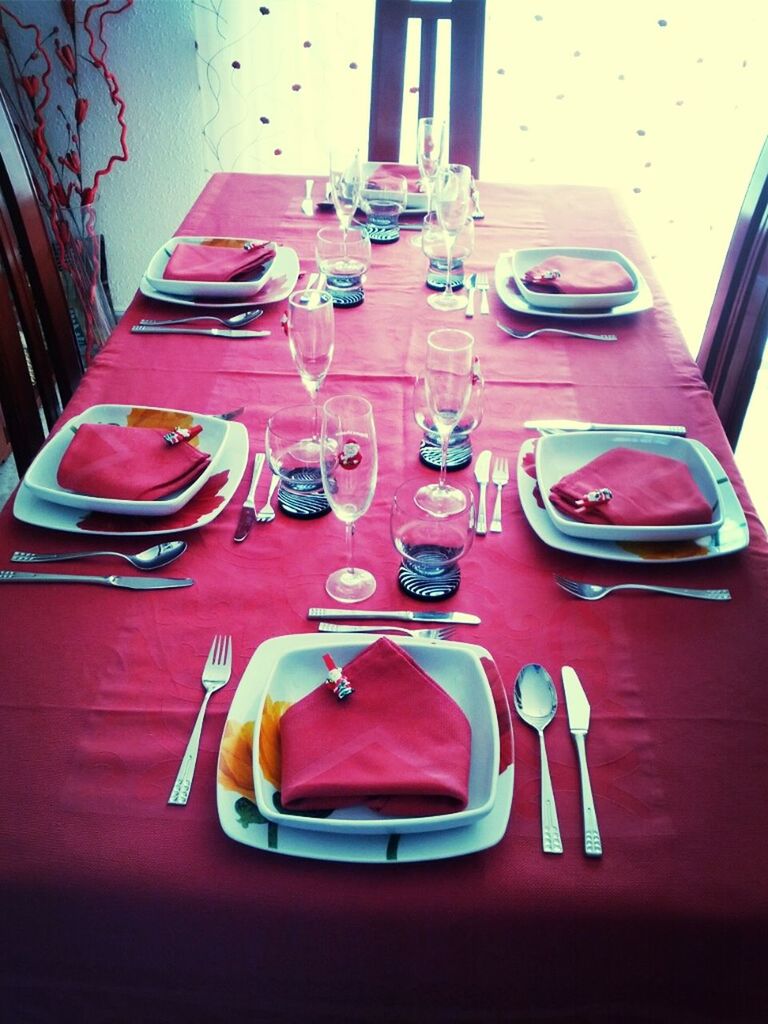 indoors, table, still life, red, food and drink, glass - material, high angle view, home interior, no people, close-up, transparent, absence, drinking glass, reflection, food, plate, window, fork, glass, wood - material