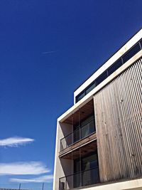 Low angle view of building against clear blue sky