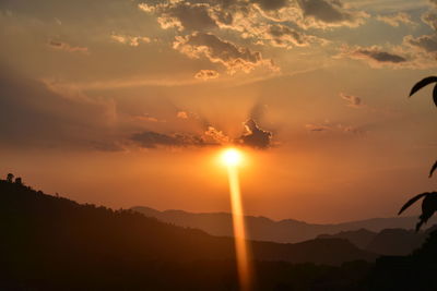 Scenic view of silhouette mountains against sky during sunset