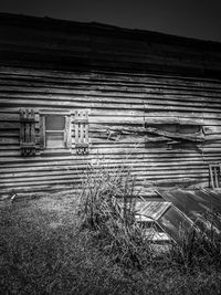 Abandoned house on field against sky