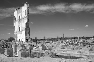 Exterior of abandoned building against sky in city