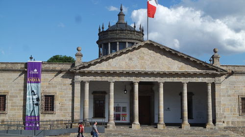 View of historical building against cloudy sky