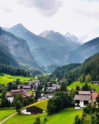 Houses on mountain against sky