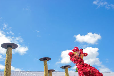 Low angle view of statue against blue sky