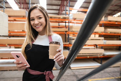 Portrait of young woman using mobile phone