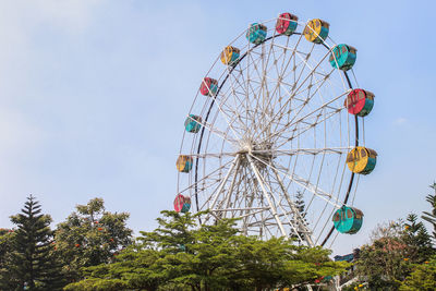 Low angle view of ferris wheel in town square