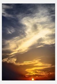 Low angle view of cloudy sky at sunset