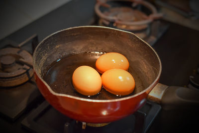 High angle view of eggs in frying pan