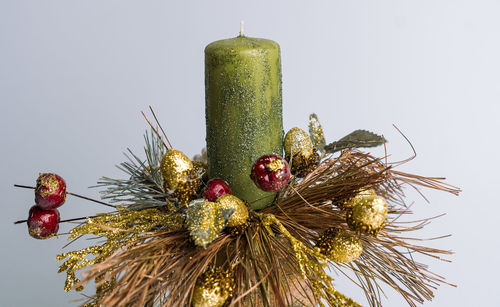 Close-up of christmas tree against white background