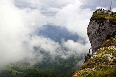 Scenic view of mountains against cloudy sky