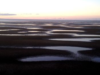 Scenic view of beach during sunset