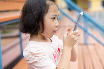 Side view of young woman looking away